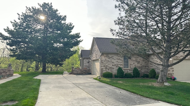 view of side of home with a garage and a yard