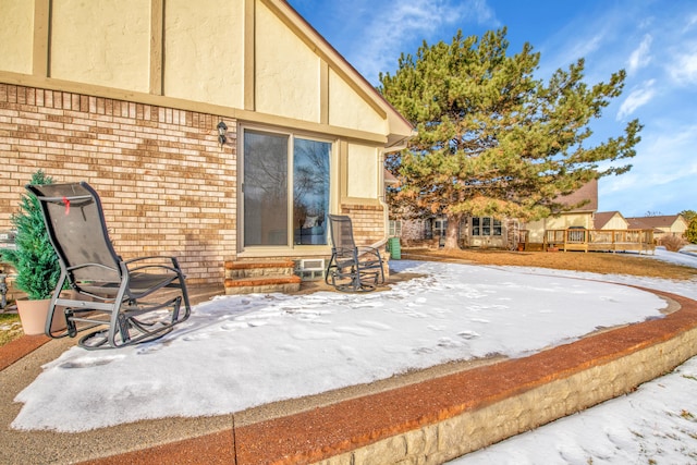 view of snow covered patio