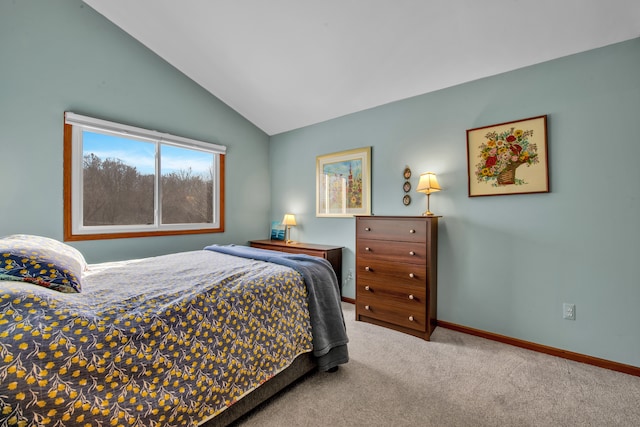 carpeted bedroom with vaulted ceiling