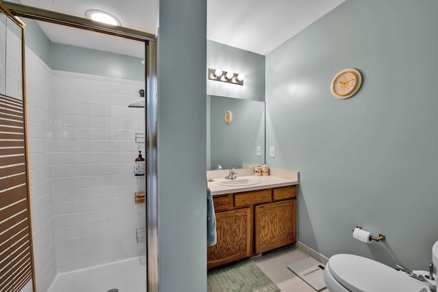 bathroom featuring vanity, toilet, tile patterned flooring, and a shower with door