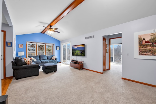 living room featuring ceiling fan, light colored carpet, and lofted ceiling with beams