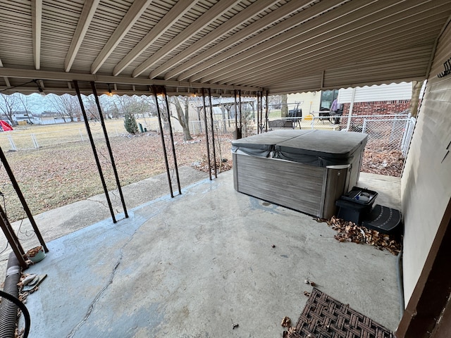 view of patio / terrace with a hot tub