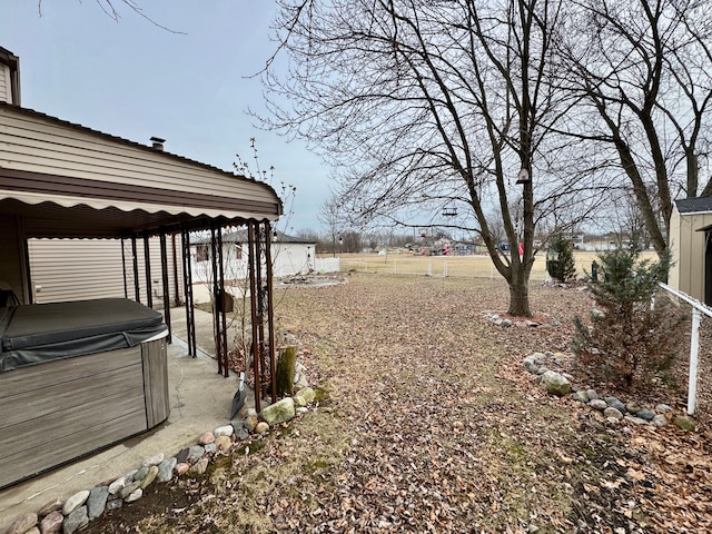 view of yard featuring a gazebo and a hot tub