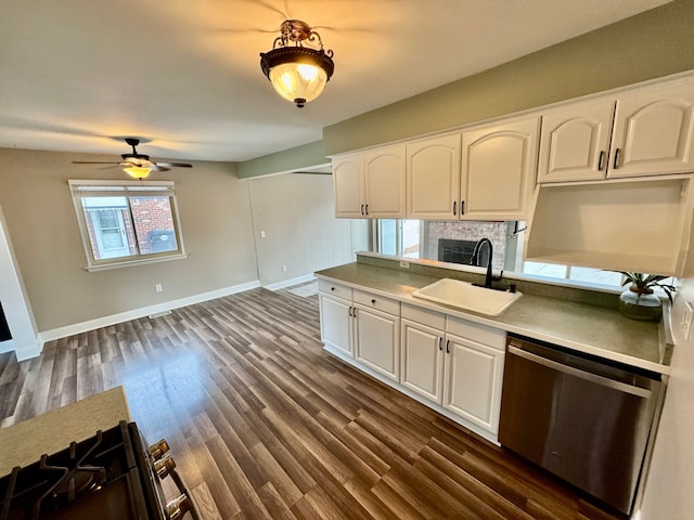 kitchen with white cabinetry, stainless steel dishwasher, dark hardwood / wood-style floors, and sink