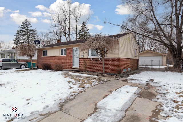 view of front of home featuring a garage and an outdoor structure