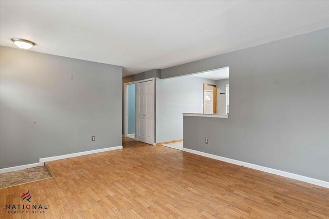 spare room featuring light wood-type flooring