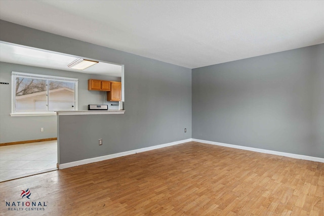 unfurnished living room with light wood-type flooring