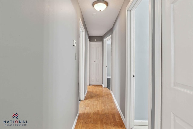 hall with light hardwood / wood-style flooring