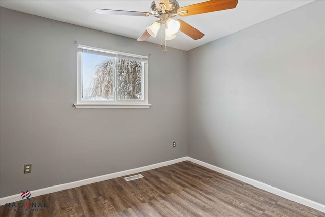 unfurnished room featuring dark wood-type flooring and ceiling fan