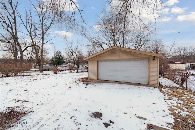 view of snow covered garage