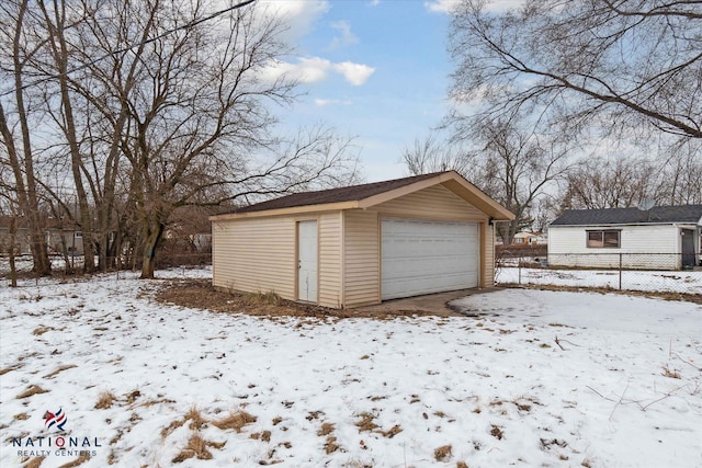 view of snow covered garage