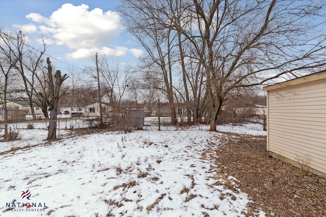 view of yard layered in snow