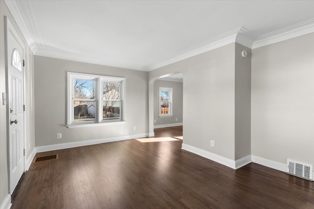 interior space with dark hardwood / wood-style flooring and ornamental molding