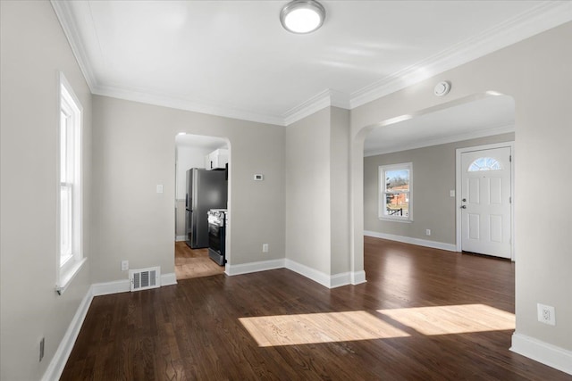 interior space with crown molding and dark hardwood / wood-style floors