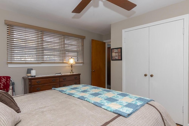 bedroom featuring ceiling fan and a closet