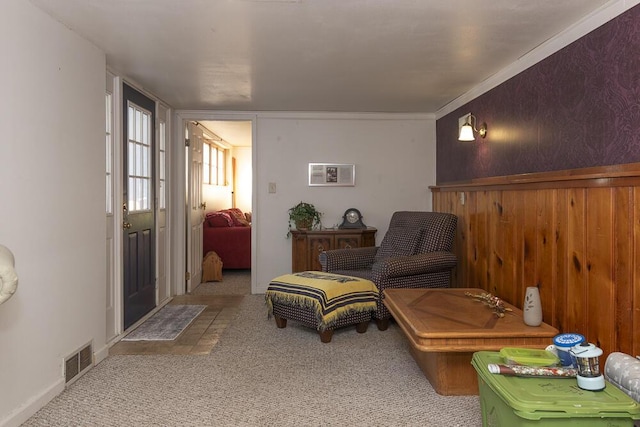 sitting room featuring light carpet