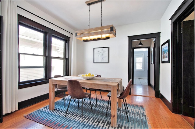 dining space featuring light wood-type flooring