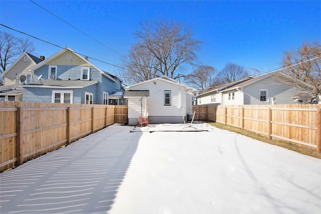 back of property with an outbuilding