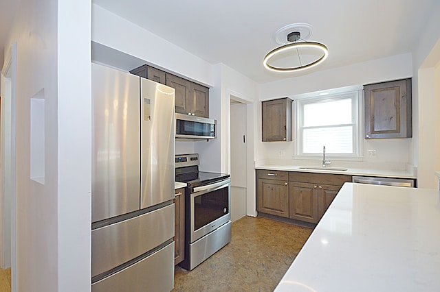 kitchen featuring stainless steel appliances and sink