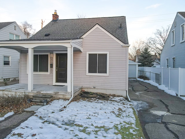 view of front facade with a porch and a garage