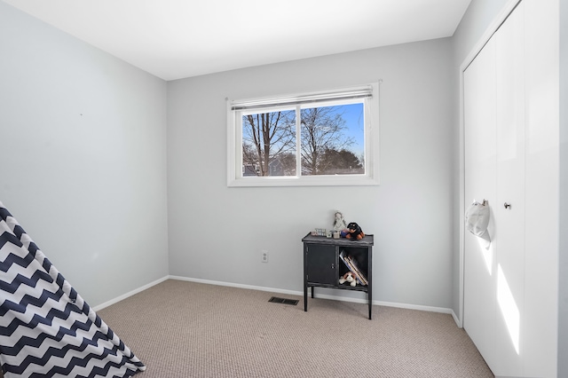 carpeted bedroom with a closet