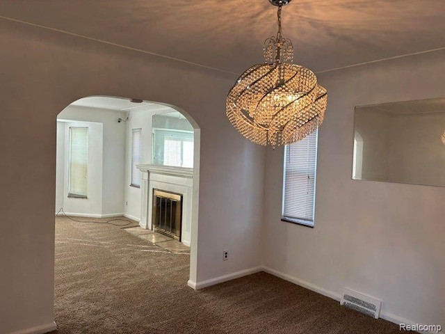 unfurnished living room featuring carpet