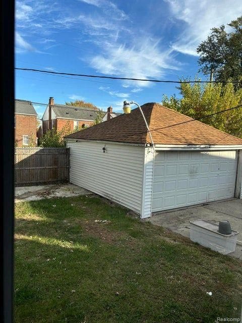 garage featuring a yard