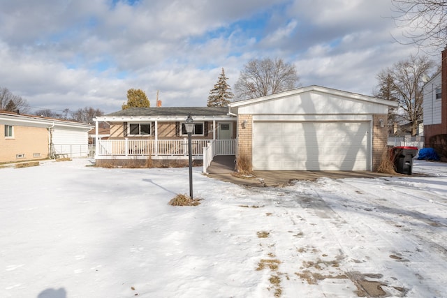 view of front of home with a garage and a porch