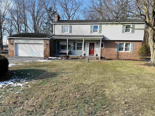 view of front property with a porch, a garage, and a front lawn