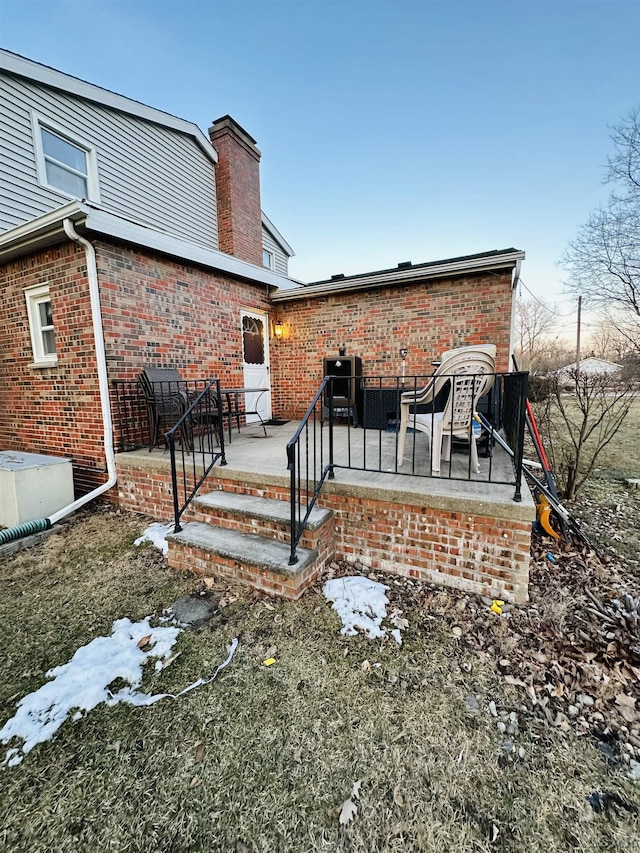 back of property featuring a patio and central AC unit