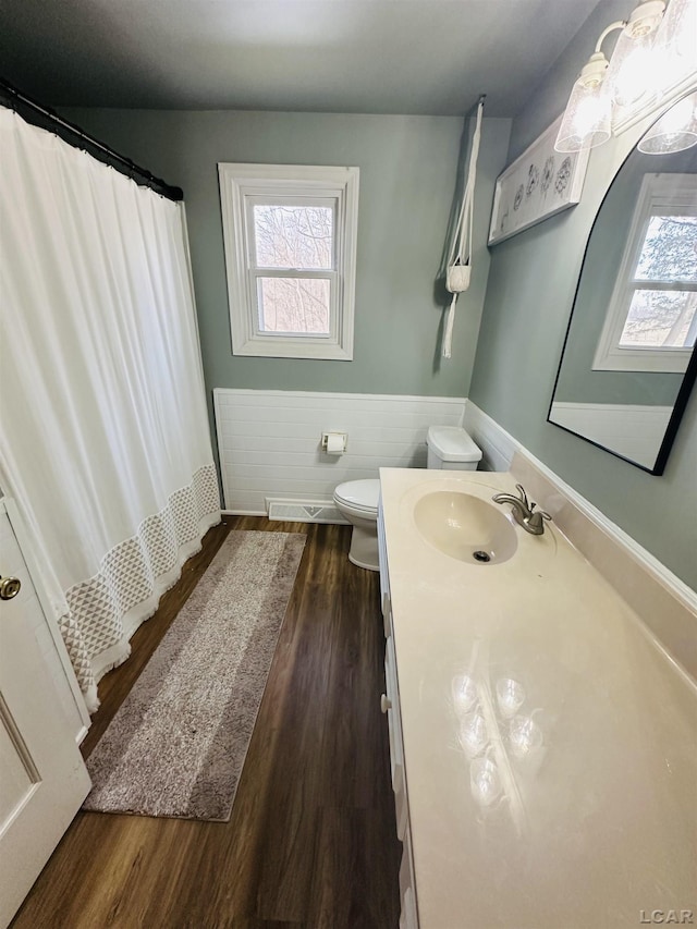 bathroom featuring vanity, a shower with curtain, wood-type flooring, and toilet