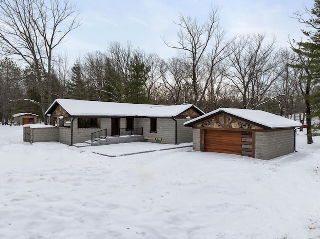 view of front of property with an outbuilding and a garage