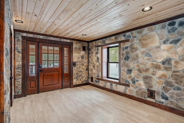 foyer featuring hardwood / wood-style floors and wood ceiling