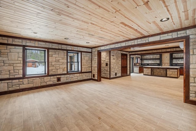 unfurnished living room featuring wooden ceiling and light wood-type flooring