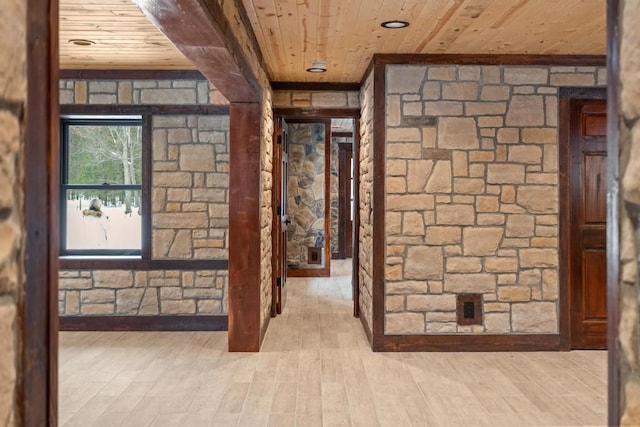 interior space with light wood-type flooring and wood ceiling