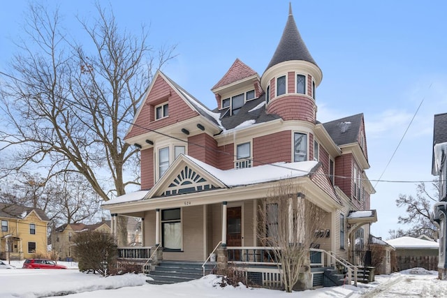 victorian-style house with a porch