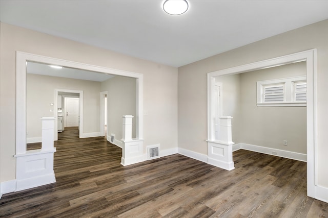 empty room featuring dark wood-type flooring