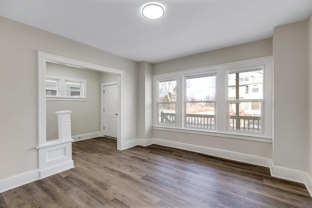 empty room featuring dark hardwood / wood-style flooring