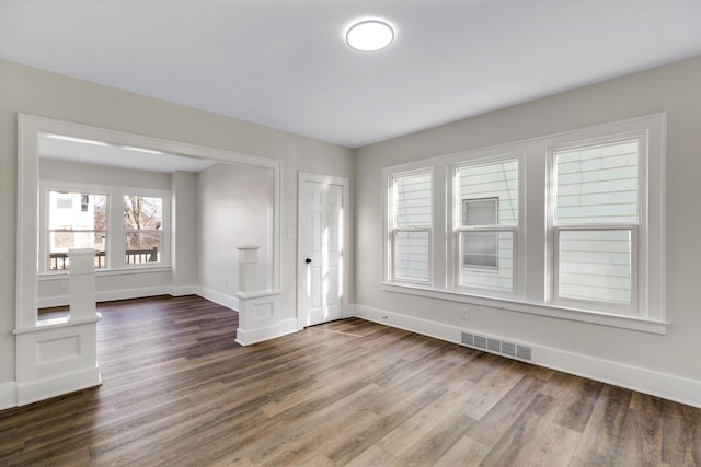 empty room featuring dark hardwood / wood-style floors