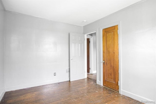 spare room with dark wood-type flooring