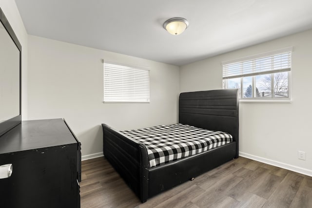 bedroom featuring hardwood / wood-style floors and a closet