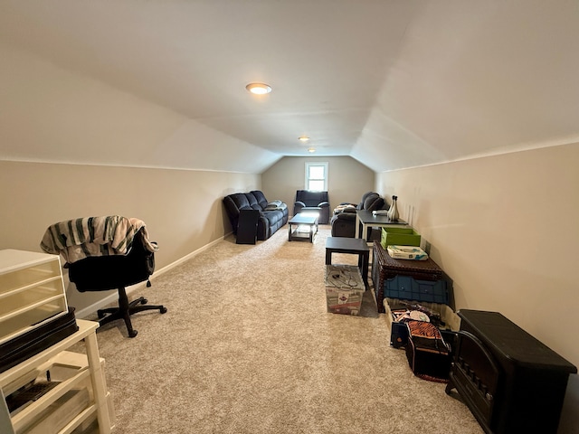 carpeted office space featuring lofted ceiling