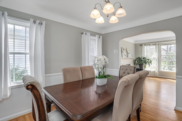 dining room featuring a chandelier and light wood-type flooring