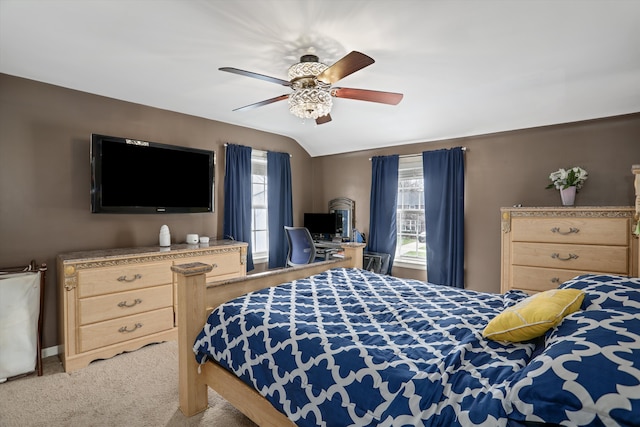 bedroom featuring multiple windows, vaulted ceiling, carpet, and ceiling fan