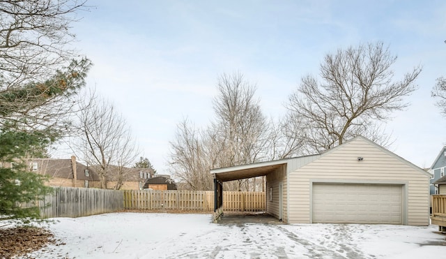 exterior space with an outbuilding, a garage, and a carport