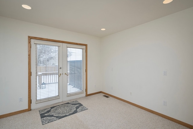 doorway to outside featuring carpet floors and french doors