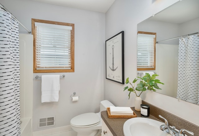 full bathroom with vanity, toilet, and shower / bath combo