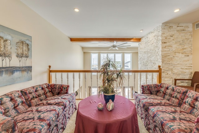 living room featuring beamed ceiling