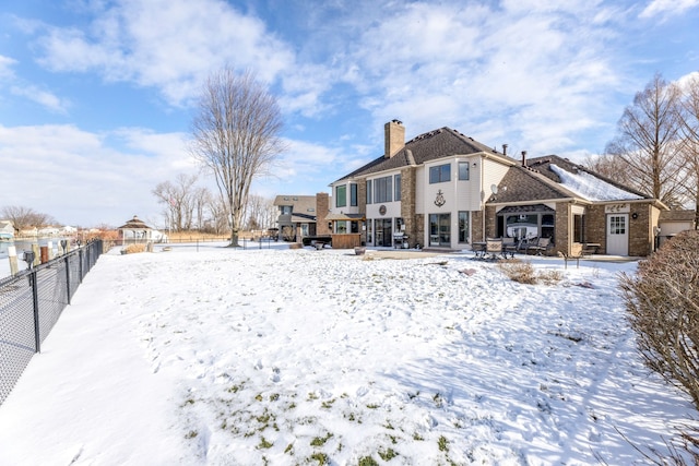 view of snow covered property