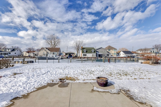 view of yard layered in snow